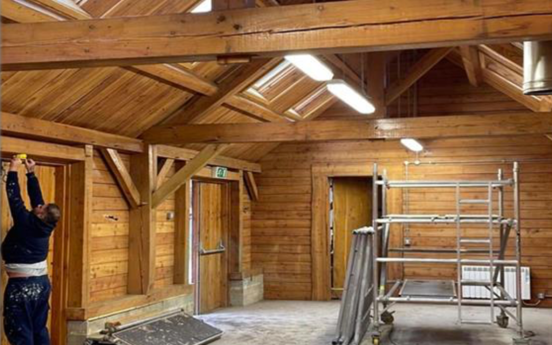 Upgrading surfaces of a timber framed and timber clad building