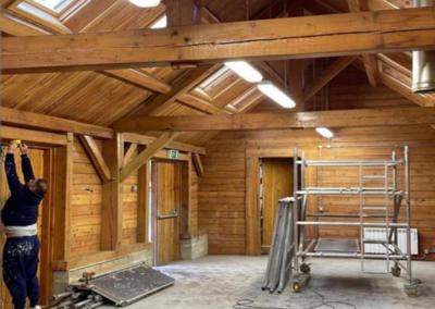 Upgrading surfaces of a timber framed and timber clad building